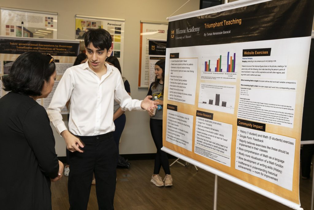 A student presenting his poster.