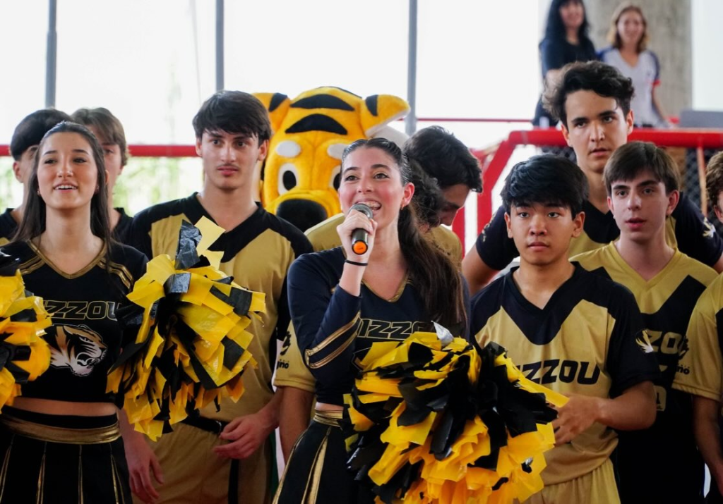 University of Missouri High School Cheerleaders and Football Players Lead a Cheer