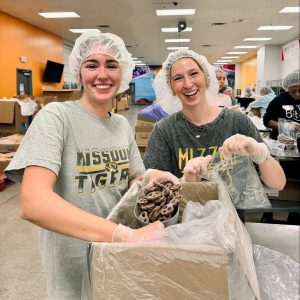 Two volunteers working at the Food Bank